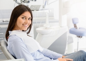 Young woman smiling in dental chair