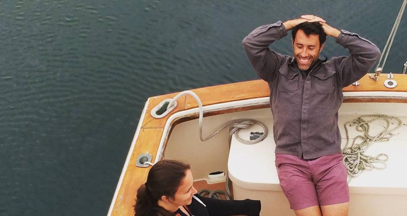 Man and woman sitting on small boat