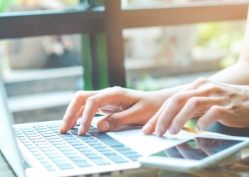 Person typing on a laptop