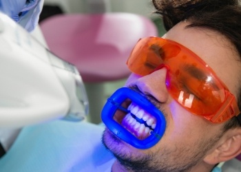 Dental patient getting his teeth professionally whitened